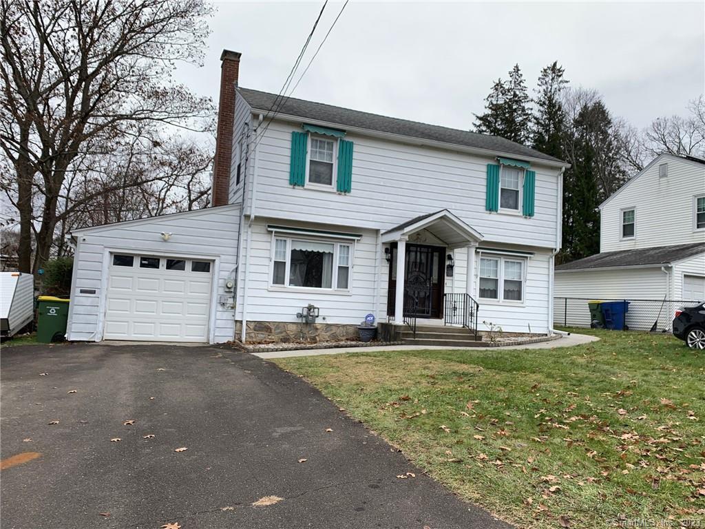 52 Gail Drive Waterbury, CT 06704 - Photo 1 of 1 a front view of a house with a yard and garage