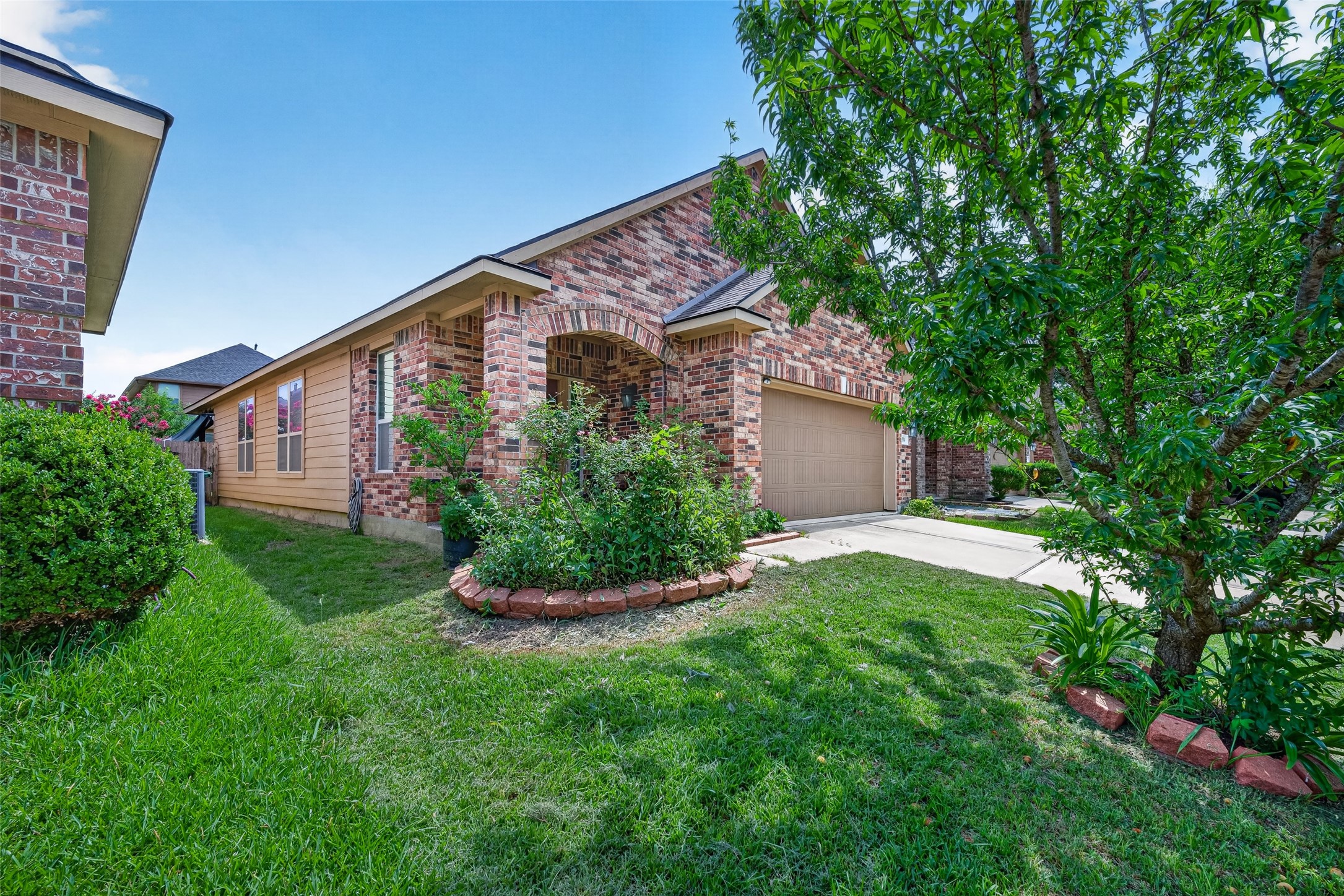 9314 Fuqua Ridge Lane Houston, TX 77075 - Photo 3 of 24 front view of a house with a yard