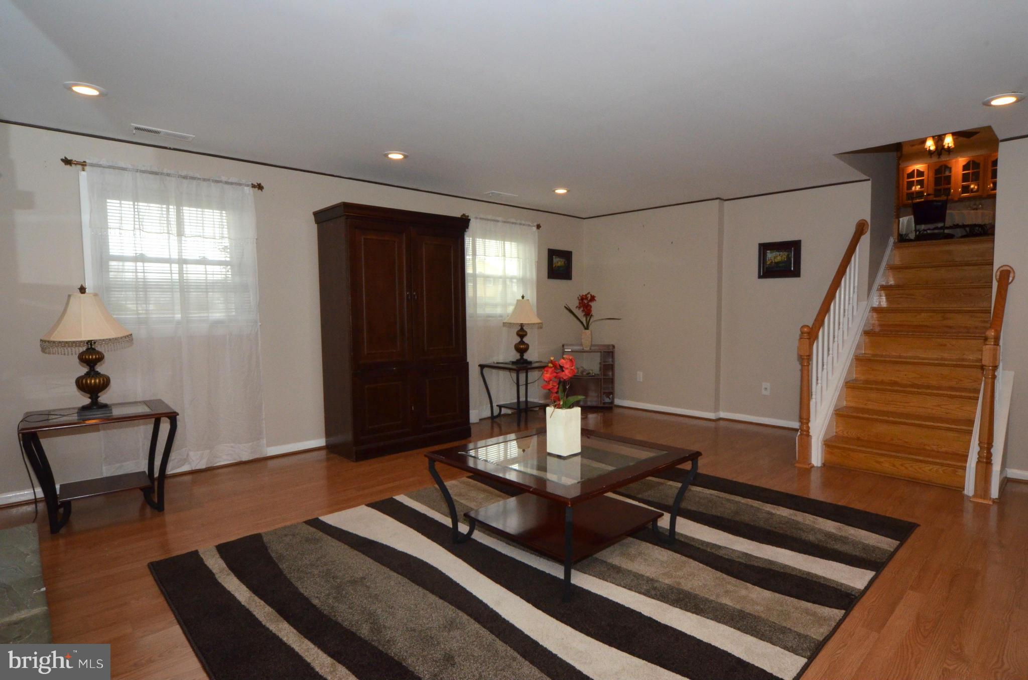 13309 Brackley Road Silver Spring, MD 20904 - Photo 14 of 28 a living room with furniture and wooden floor