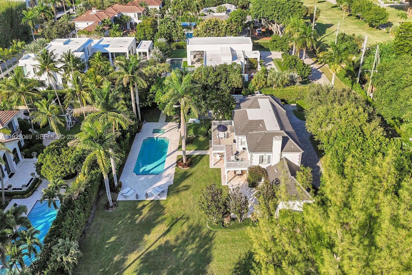 1281 Banyan Road Boca Raton, FL 33432 - Photo 68 of 69 an aerial view of a house with a yard and trees