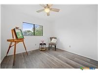 7705 Grovedale Trail Austin, TX 78729 - Photo 18 of 25 a view of workspace with wooden floor