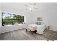 7705 Grovedale Trail Austin, TX 78729 - Photo 9 of 25 a living room with furniture and a large window