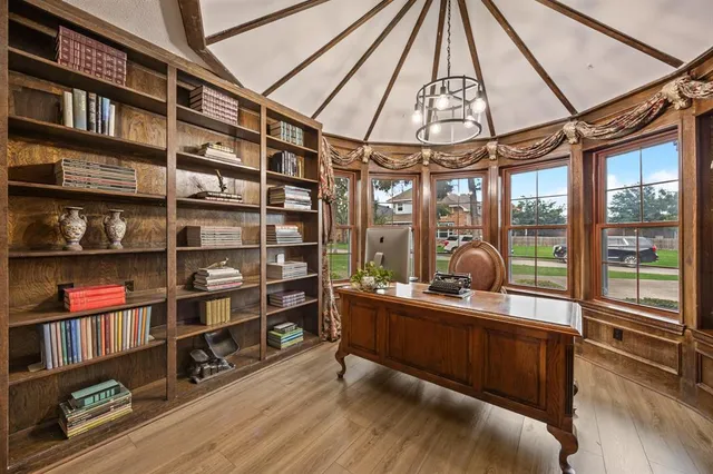 a room with wooden floor and furniture
