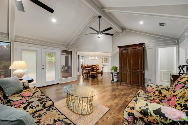 a bedroom with furniture and a chandelier