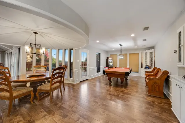 a lobby with furniture and wooden floor