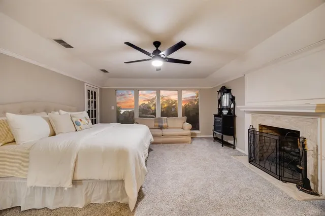 a bed room with a bed and a fireplace