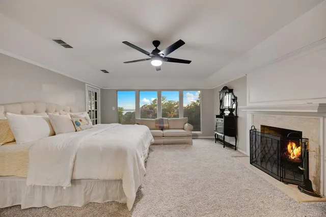 a bed room with a bed and a fireplace