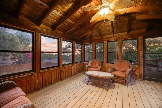 a view of a house with sitting area and wooden flooring