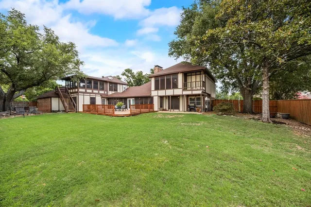 a backyard of a house with lots of green space