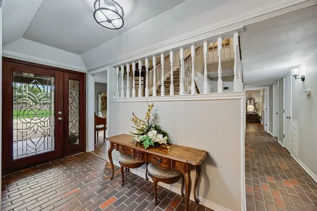 a view of a room that has a table and chairs