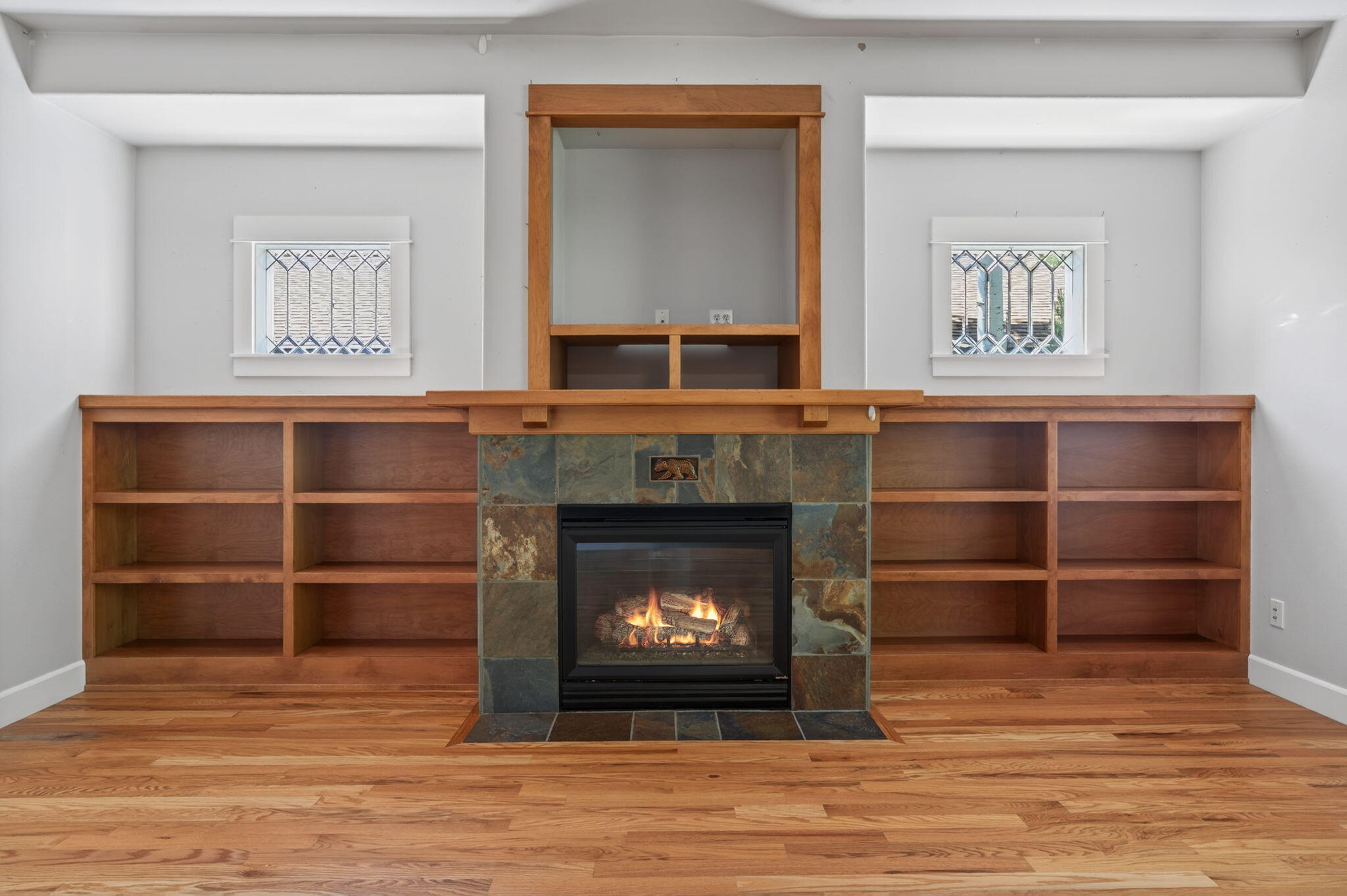 2436 Northwest Awbrey Road Bend, OR 97703 - Photo 7 of 36 Gas fireplace and built-in shelving / bookcases