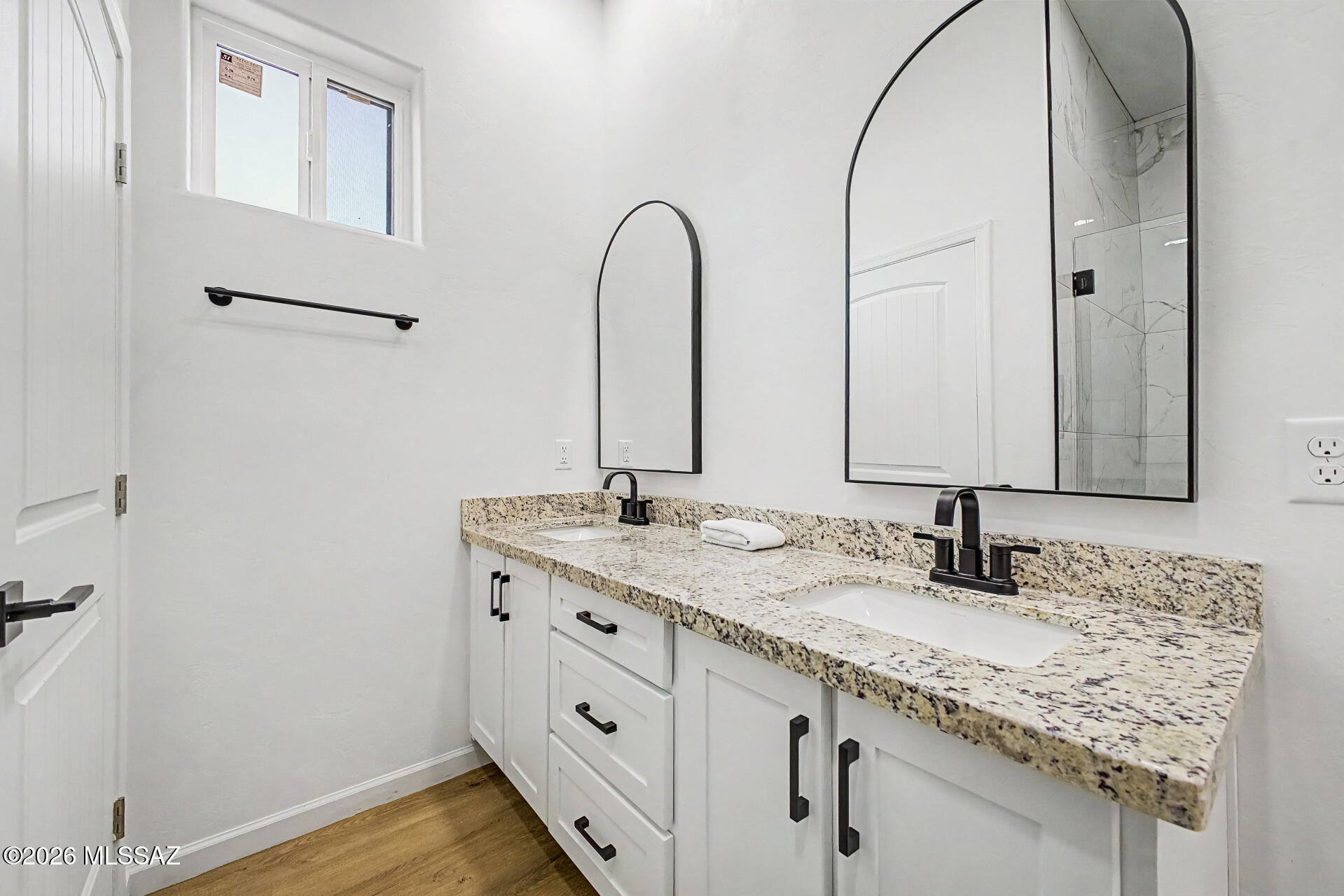 4601 East Magoo Road Tucson, AZ 85739 - Photo 14 of 38 a bathroom with a granite countertop sink and a mirror
