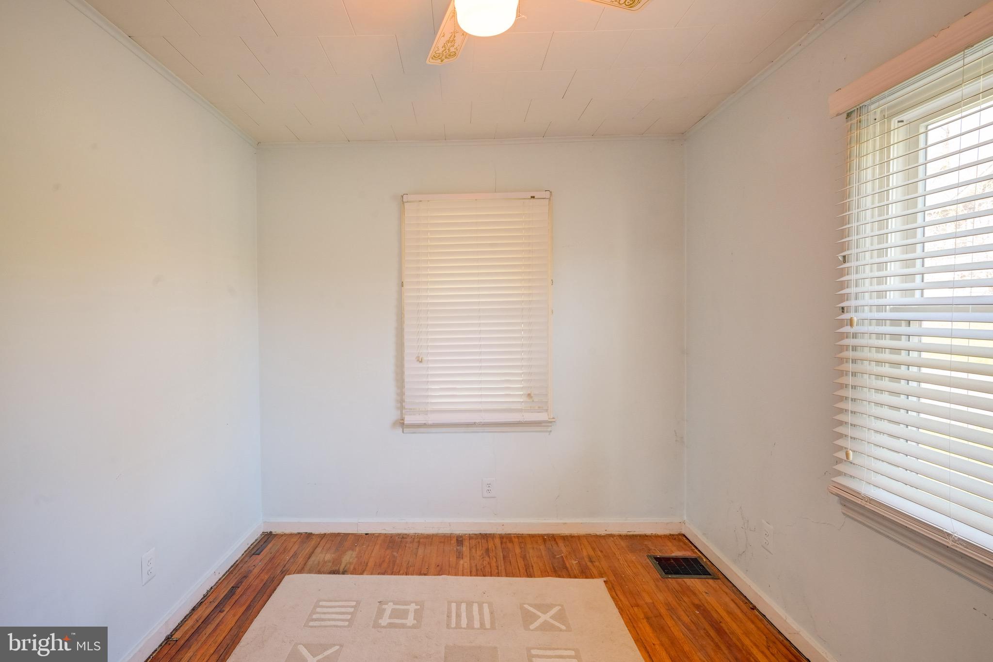 5630 Oakland Road Baltimore, MD 21227 - Photo 21 of 31 a view of a room with wooden floor and window