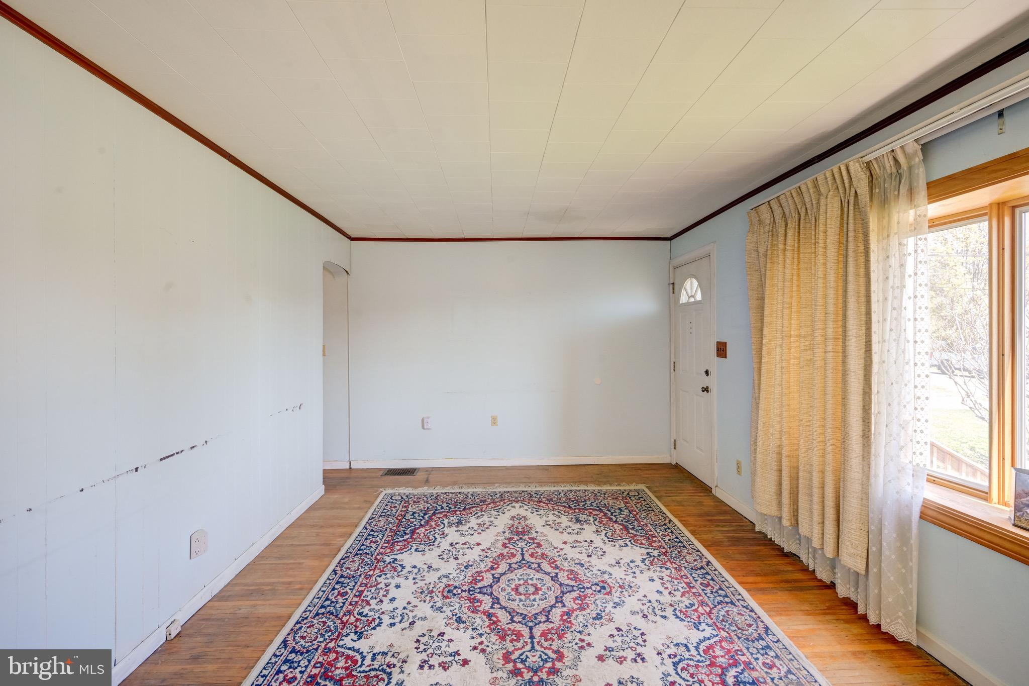 5630 Oakland Road Baltimore, MD 21227 - Photo 3 of 31 a view of an empty room