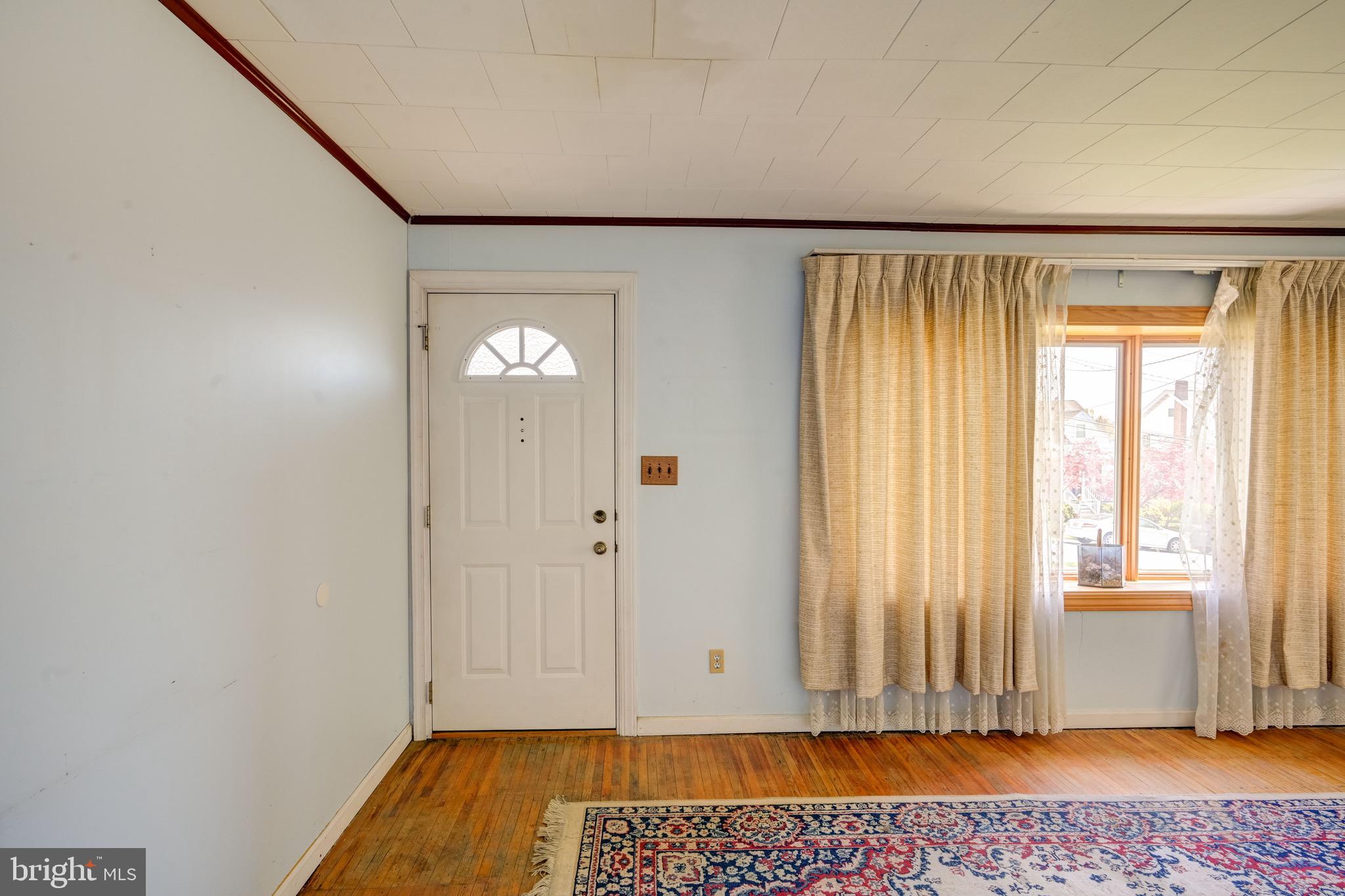 5630 Oakland Road Baltimore, MD 21227 - Photo 4 of 31 a view of room with window and entryway