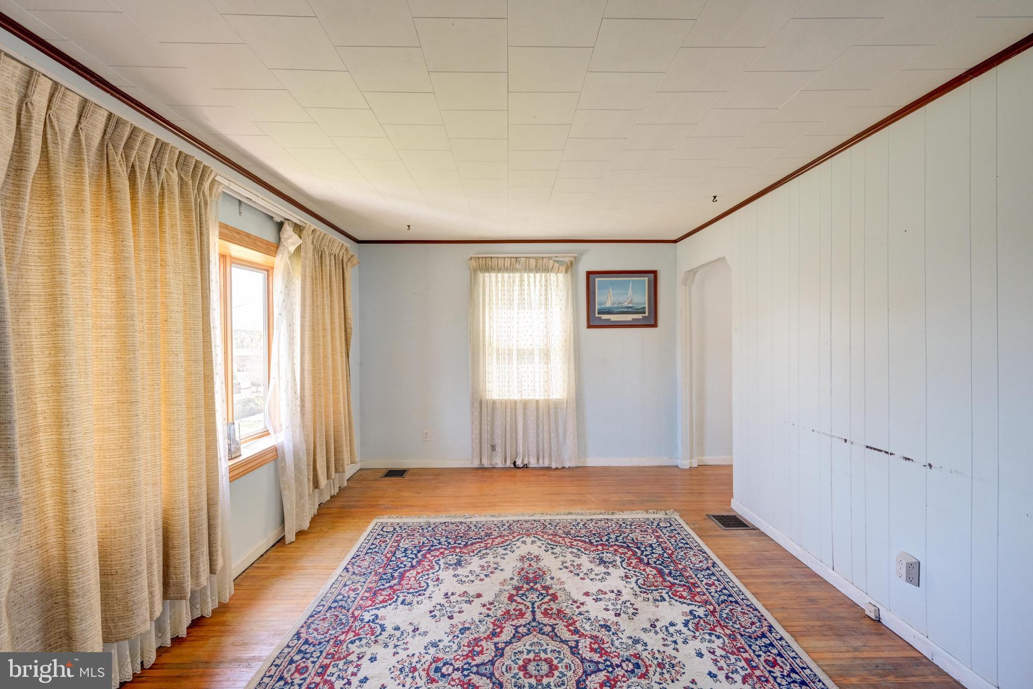 5630 Oakland Road Baltimore, MD 21227 - Photo 5 of 31 a view of an empty room and window