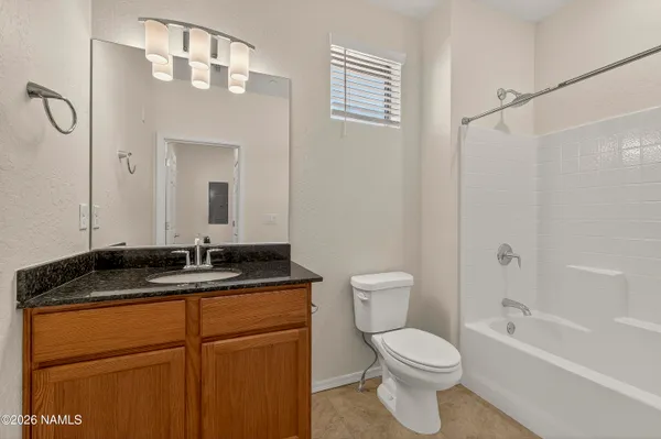 a room with a mirror and a sink