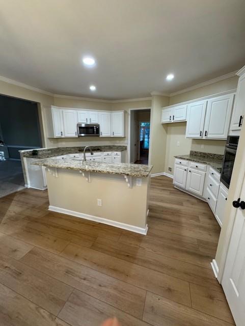 4055 Vista Point Lane Suwanee, GA 30024 - Photo 13 of 42 a view of kitchen with granite countertop a stove top oven a sink a counter top space and cabinets