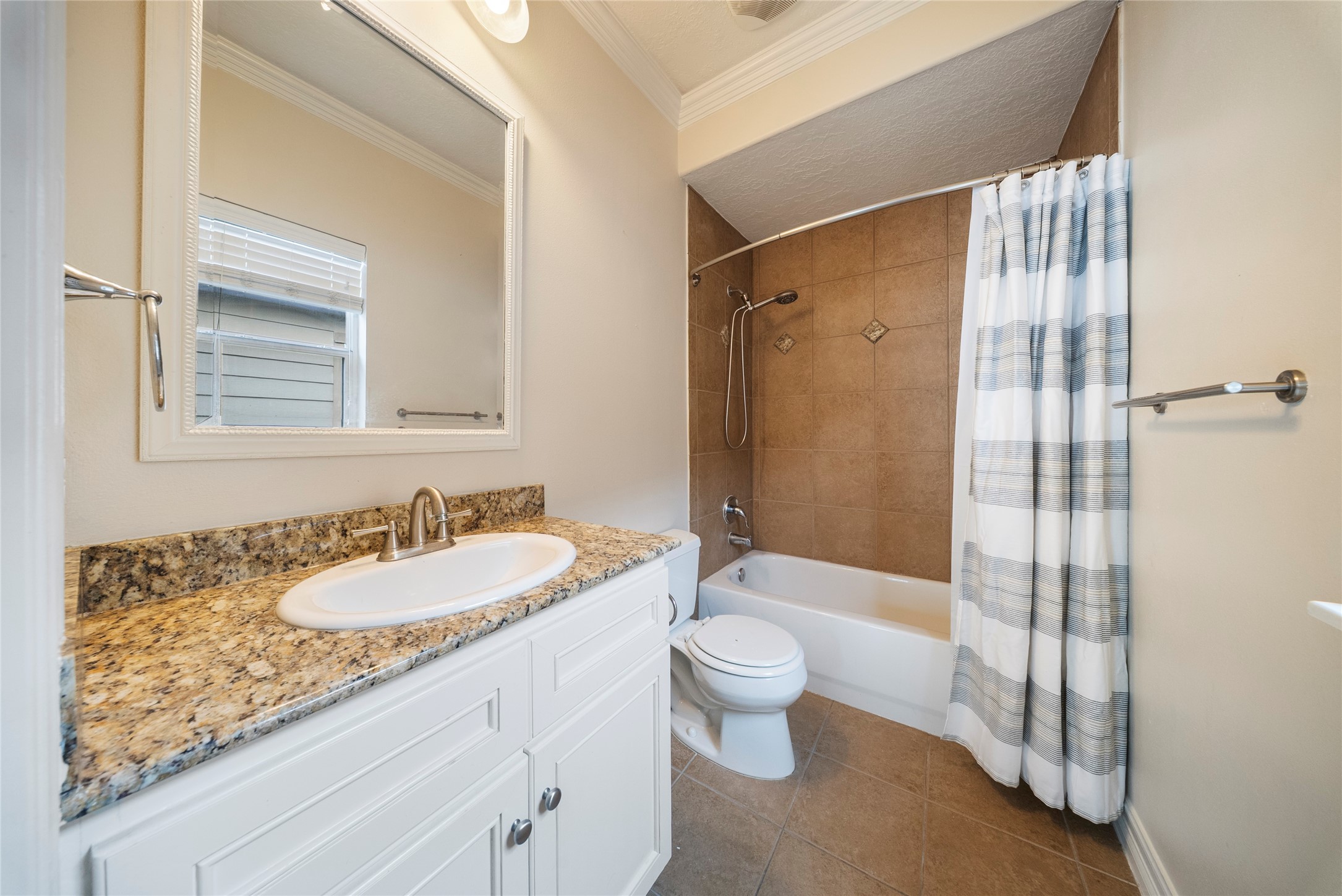 4216 Eli Street Houston, TX 77007 - Photo 15 of 19 a bathroom with a granite countertop sink and a mirror