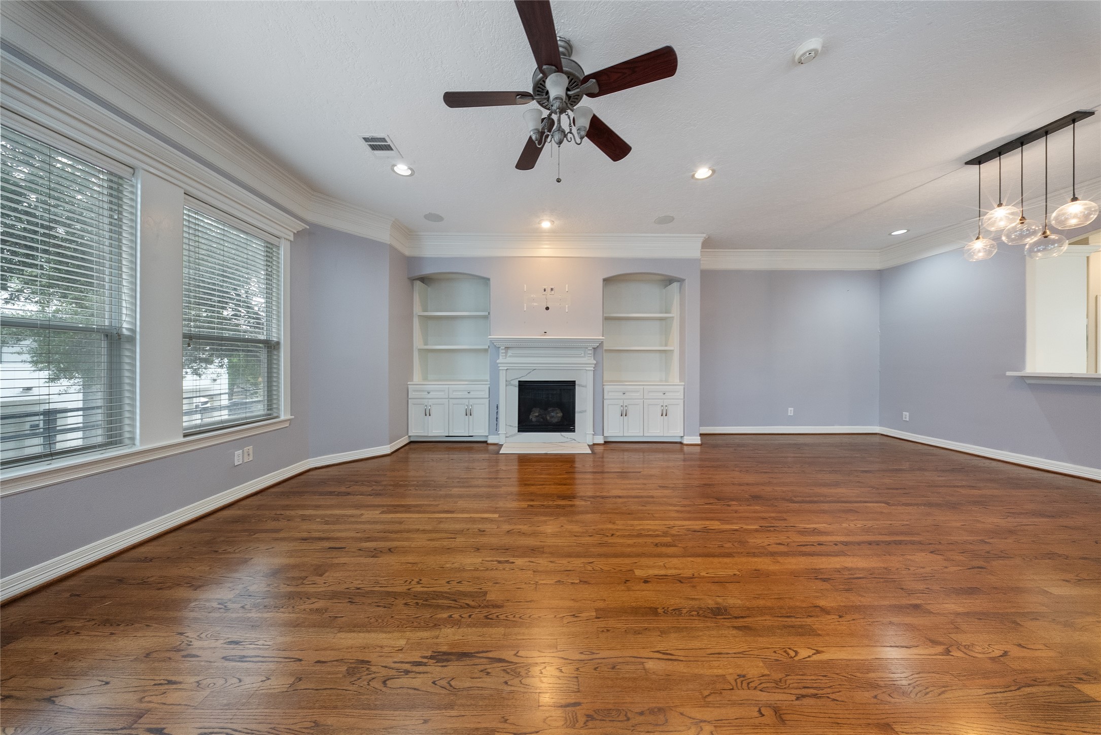 4216 Eli Street Houston, TX 77007 - Photo 6 of 19 a view of empty room with wooden floor and fan