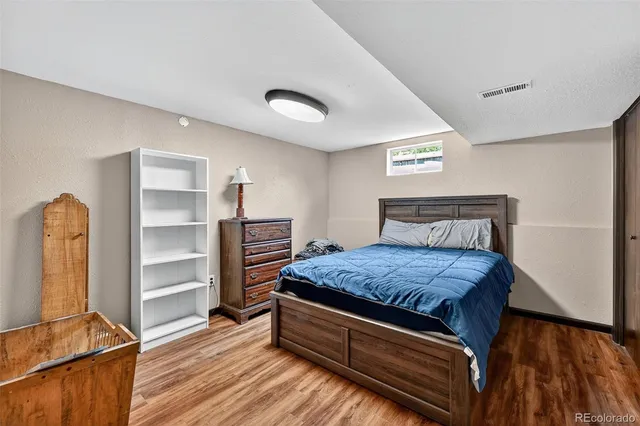 a bedroom with a bed and a walk in closet