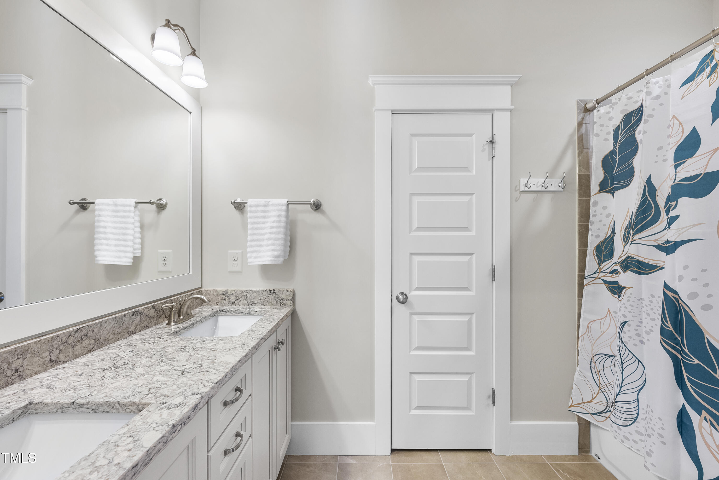 707 Sasser Street Raleigh, NC 27604 - Photo 25 of 38 a bathroom with a granite countertop sink and a mirror