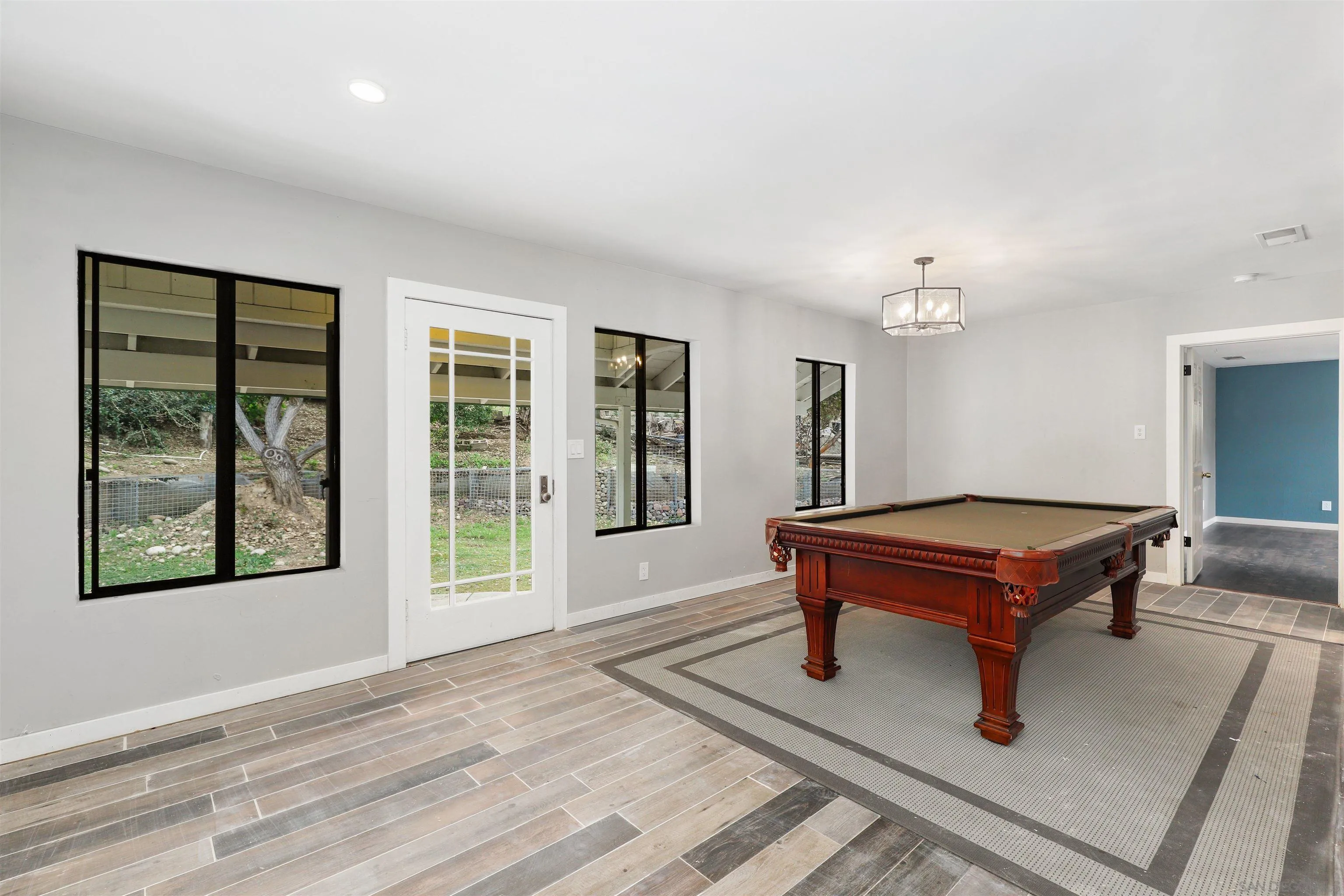 12256 Old Stone Road Poway, CA 92064 - Photo 13 of 31 a room with pool table and windows