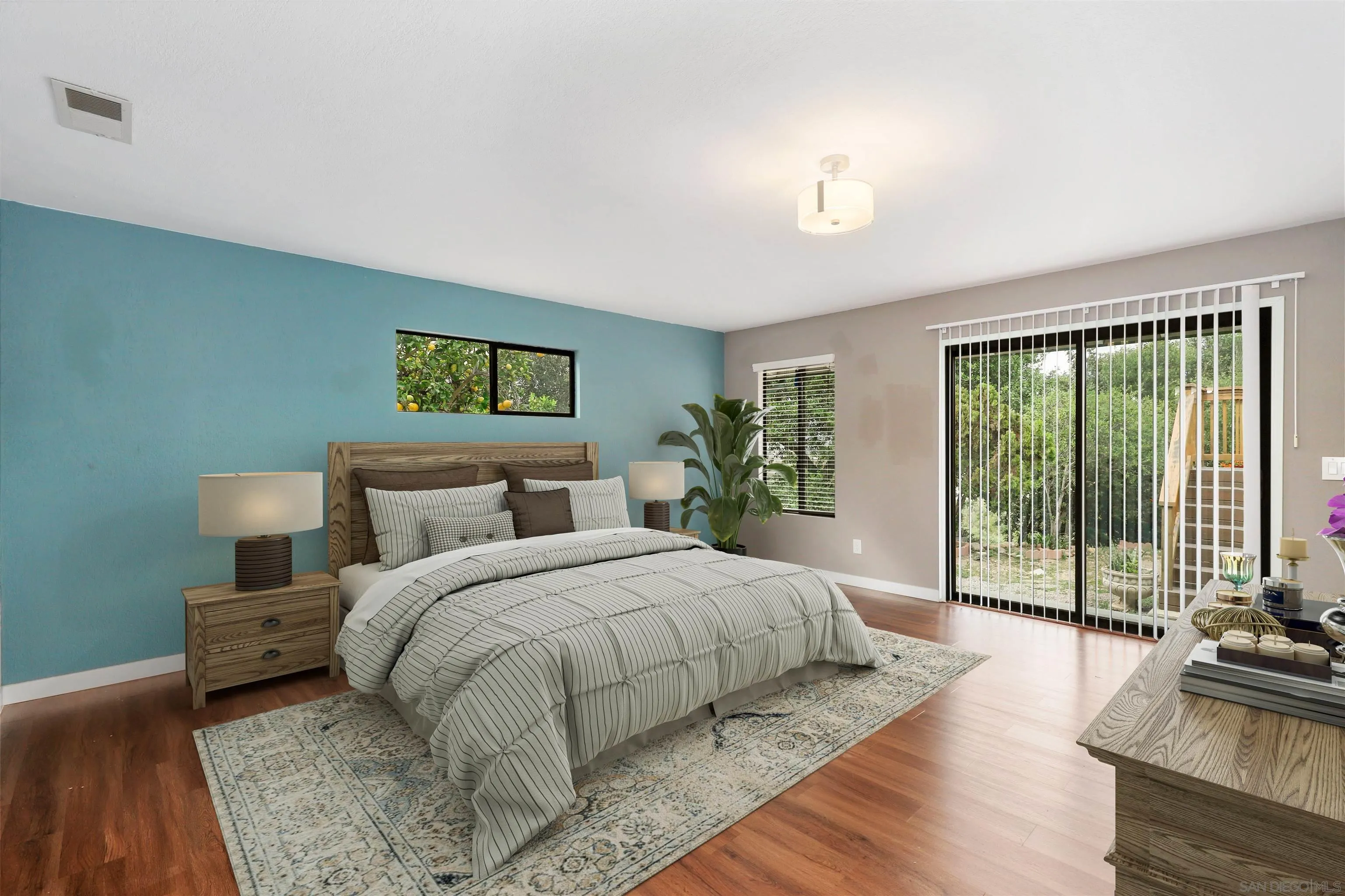 12256 Old Stone Road Poway, CA 92064 - Photo 14 of 31 a bedroom with a large bed and a large window