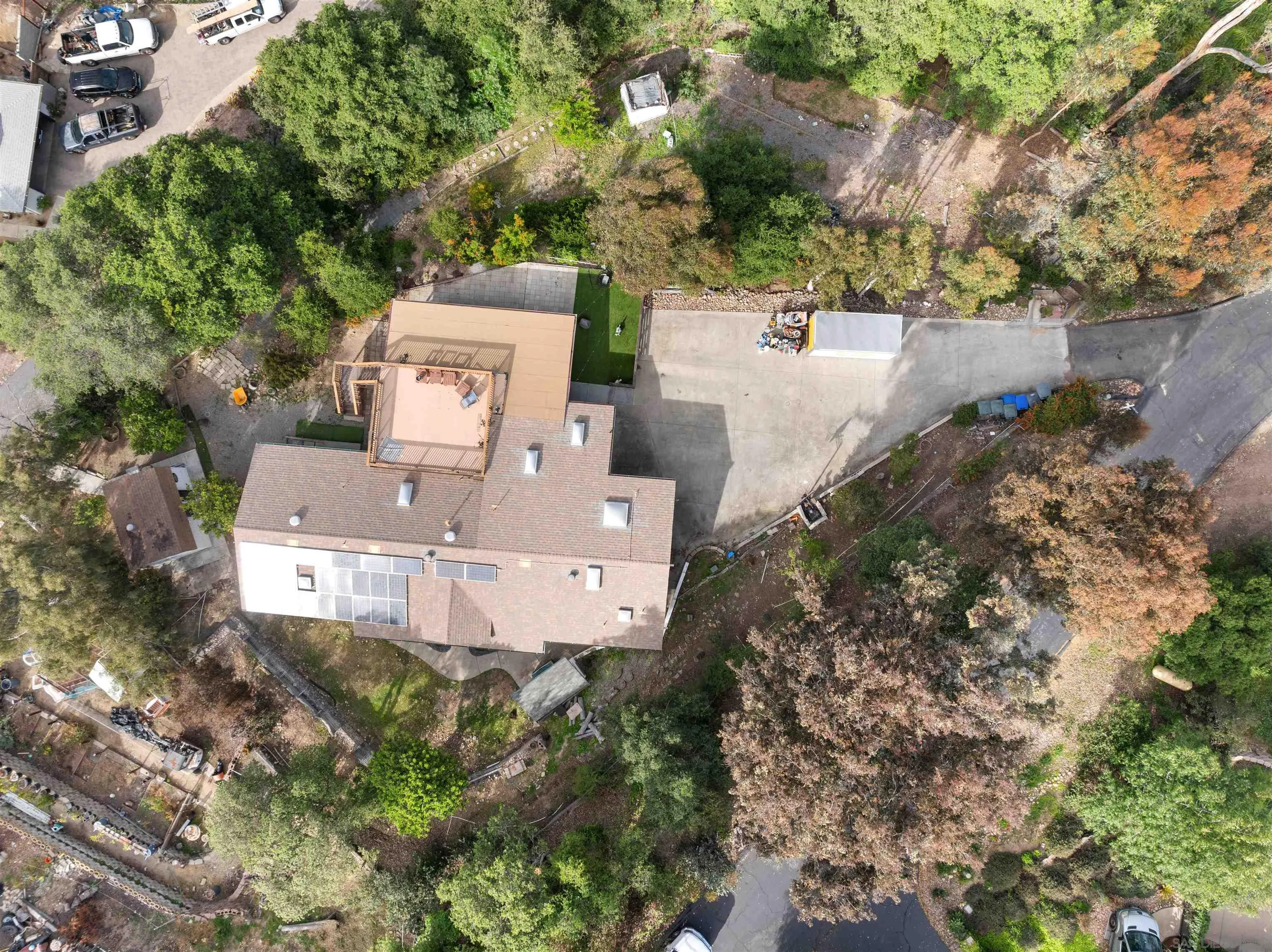 12256 Old Stone Road Poway, CA 92064 - Photo 2 of 31 an aerial view of a house with a yard and green space