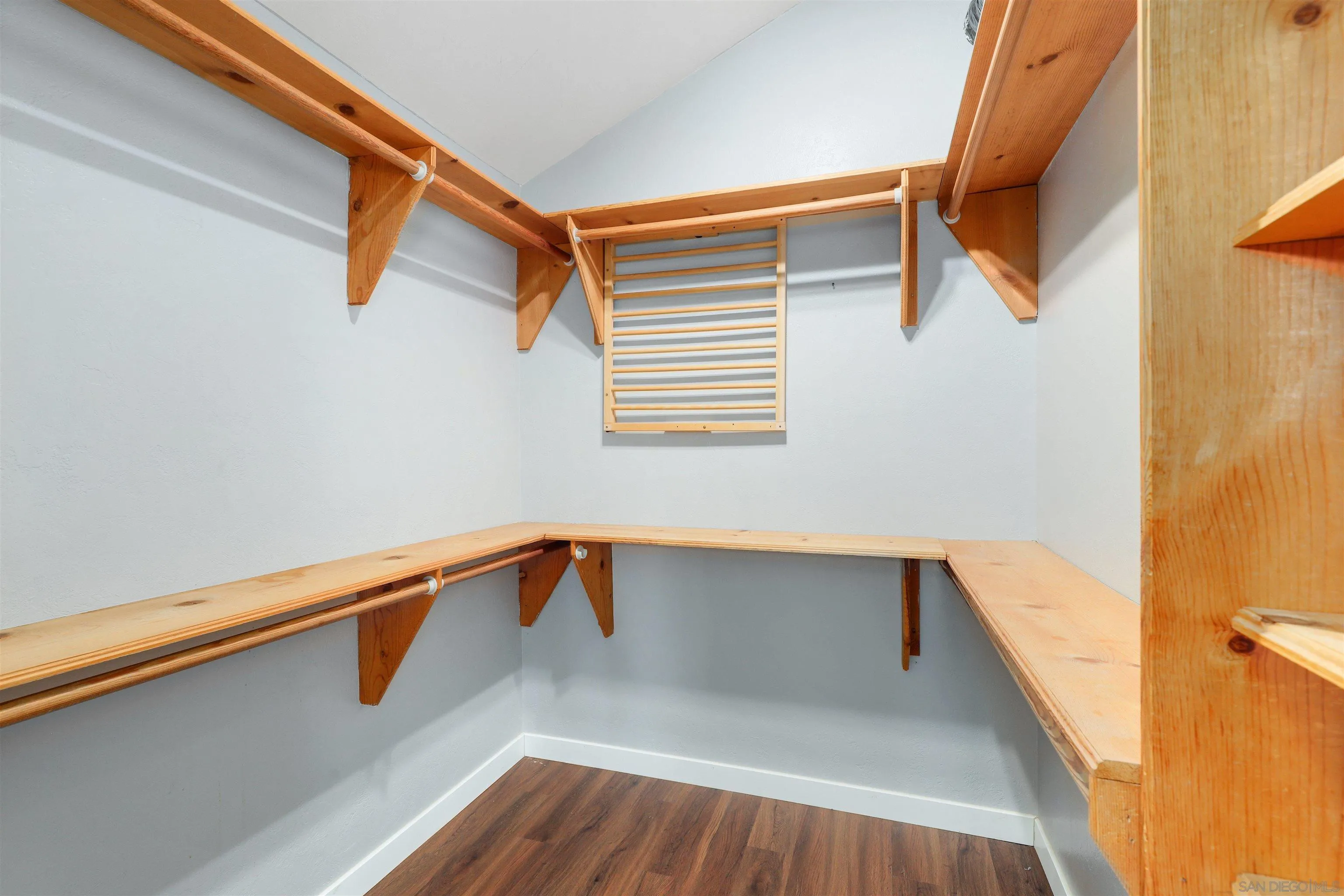 12256 Old Stone Road Poway, CA 92064 - Photo 21 of 31 a view of a room with wooden floor and a window