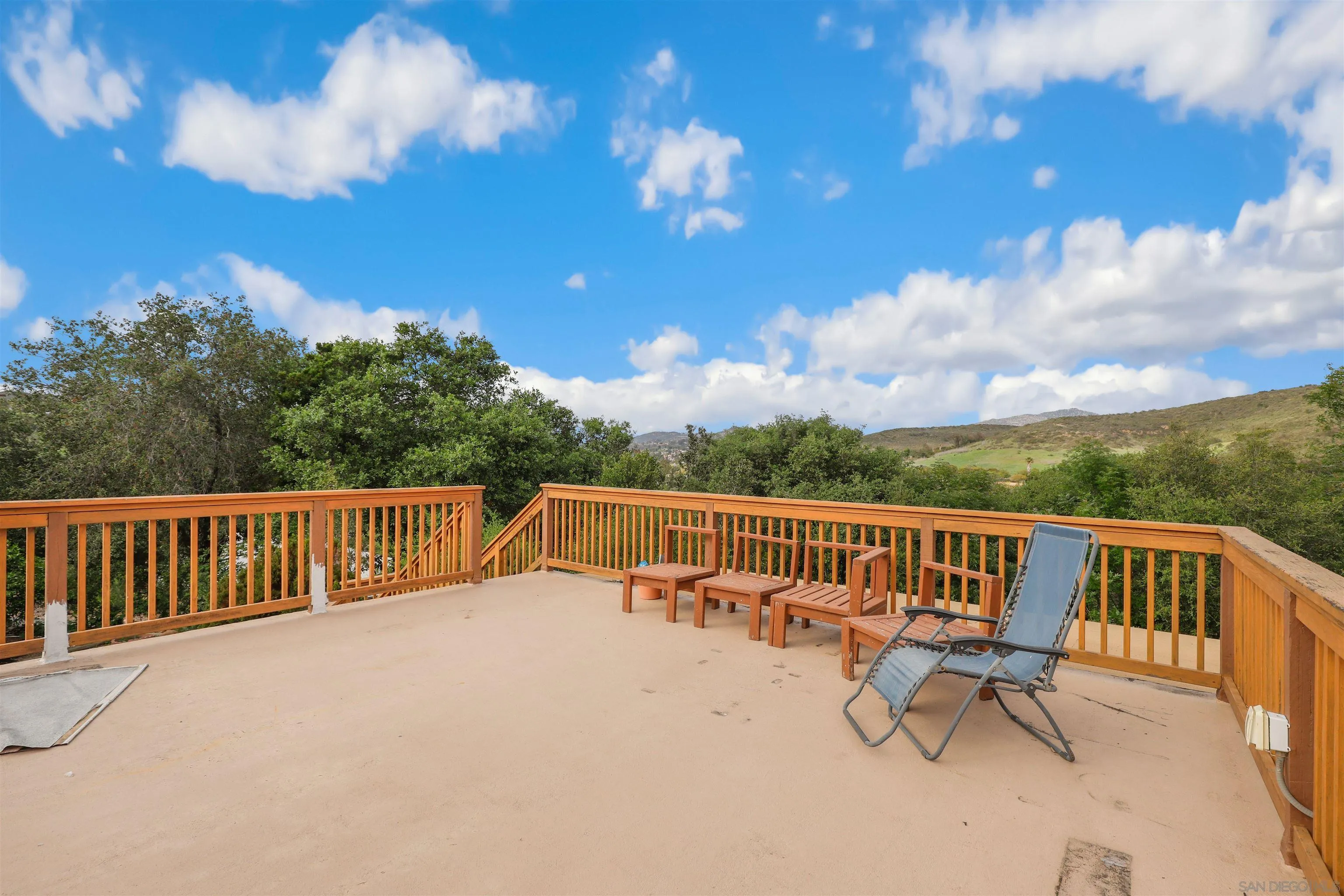 12256 Old Stone Road Poway, CA 92064 - Photo 24 of 31 a view of balcony with wooden floor and outdoor seating