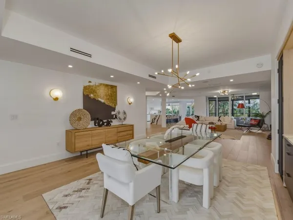 a very nice looking dining room with a table and chairs