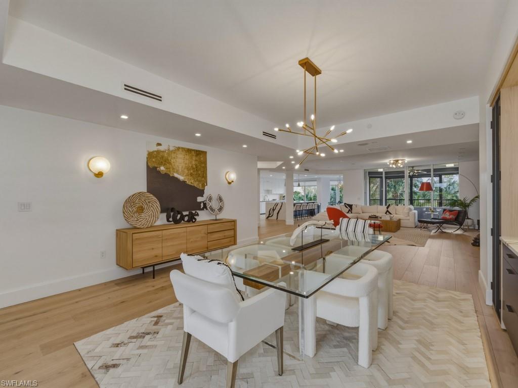 8787 Bay Colony Drive, Unit 306 Naples, FL 34108 - Photo 17 of 40 a very nice looking dining room with a table and chairs