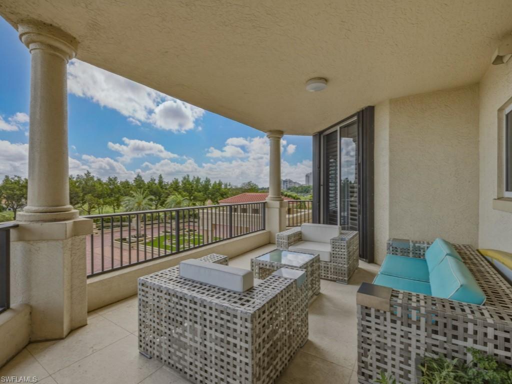 8787 Bay Colony Drive, Unit 306 Naples, FL 34108 - Photo 33 of 40 a living room with furniture