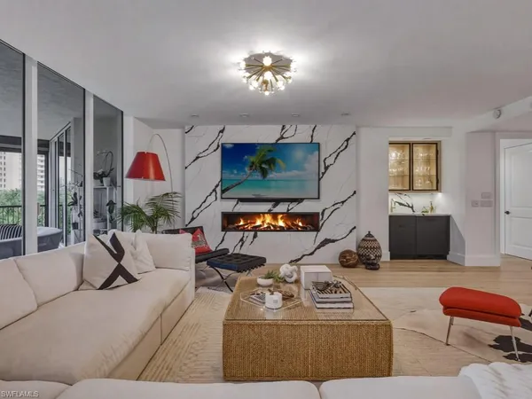 a living room with furniture and a flat screen tv