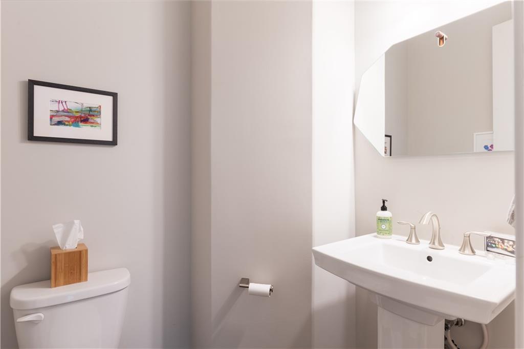 1940 Townsend Court, Unit 15 Atlanta, GA 30329 - Photo 11 of 36 a bathroom with a sink and a mirror