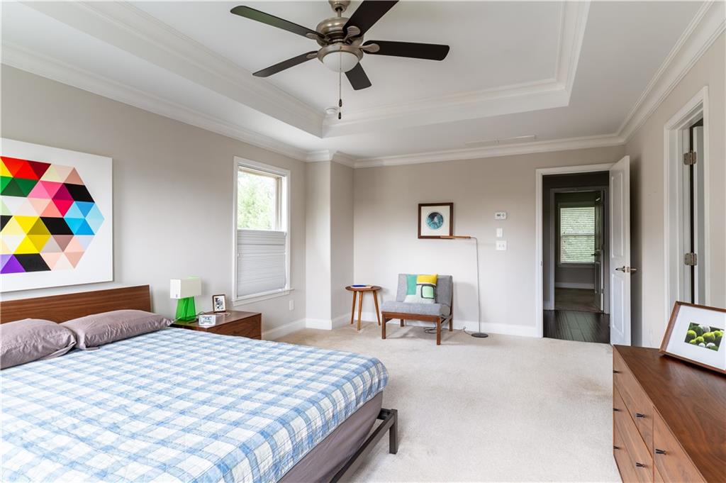 1940 Townsend Court, Unit 15 Atlanta, GA 30329 - Photo 12 of 36 a bedroom with a bed and a chandelier