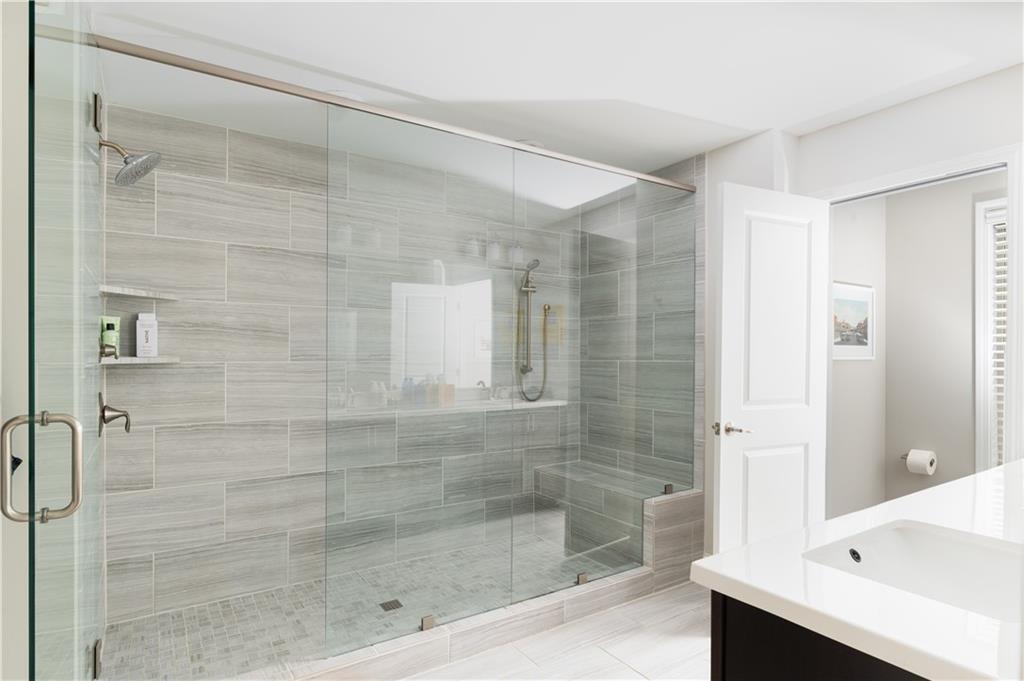 1940 Townsend Court, Unit 15 Atlanta, GA 30329 - Photo 14 of 36 a bathroom with a shower and a bathtub