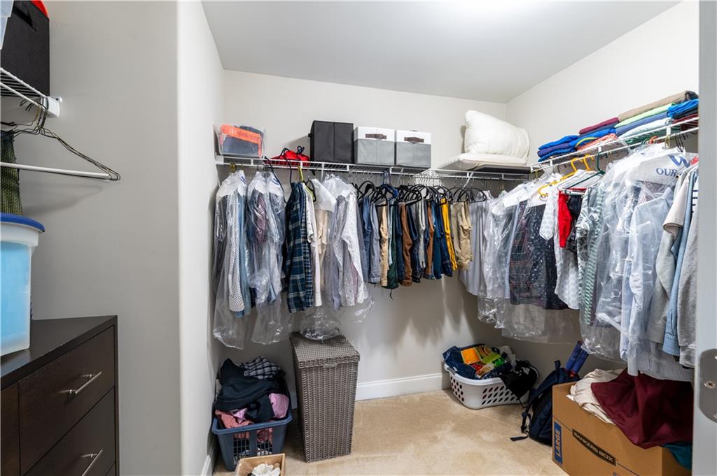 1940 Townsend Court, Unit 15 Atlanta, GA 30329 - Photo 17 of 36 a view of walk in closet with clothes and shoes