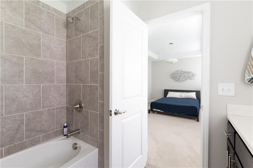 1940 Townsend Court, Unit 15 Atlanta, GA 30329 - Photo 20 of 36 a bathroom with a shower a bathtub and a shower