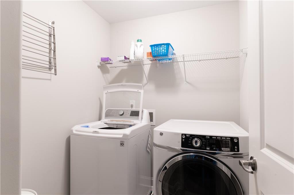 1940 Townsend Court, Unit 15 Atlanta, GA 30329 - Photo 22 of 36 a utility room with dryer and washer