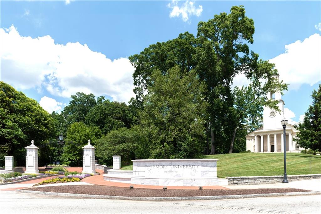 1940 Townsend Court, Unit 15 Atlanta, GA 30329 - Photo 28 of 36 a view of a yard in front of a house with large trees