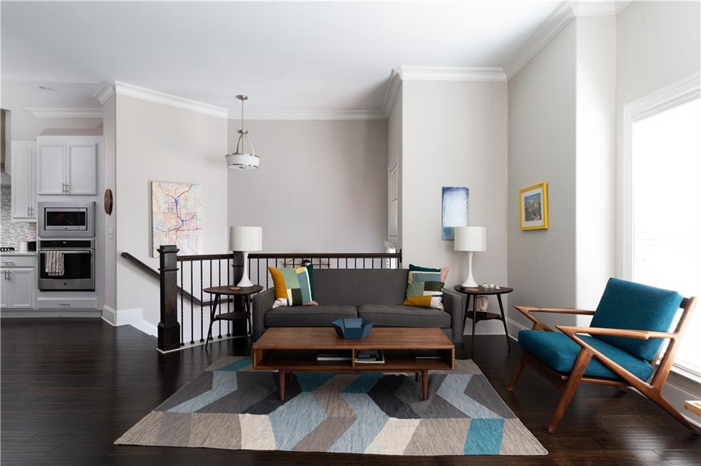 1940 Townsend Court, Unit 15 Atlanta, GA 30329 - Photo 6 of 36 a living room with furniture rug and a dining table