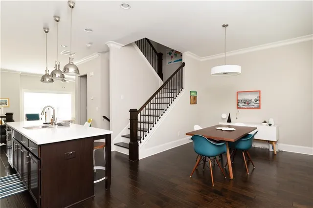 a view of a dining room with furniture and wooden floor