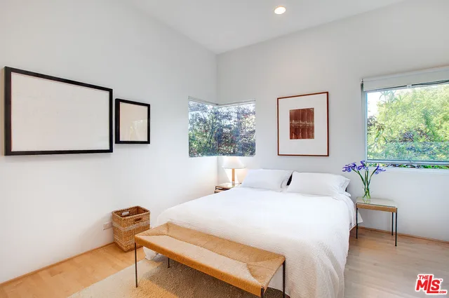 a bedroom with a bed and a table