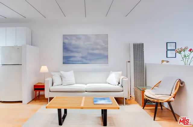 a living room with furniture and a table