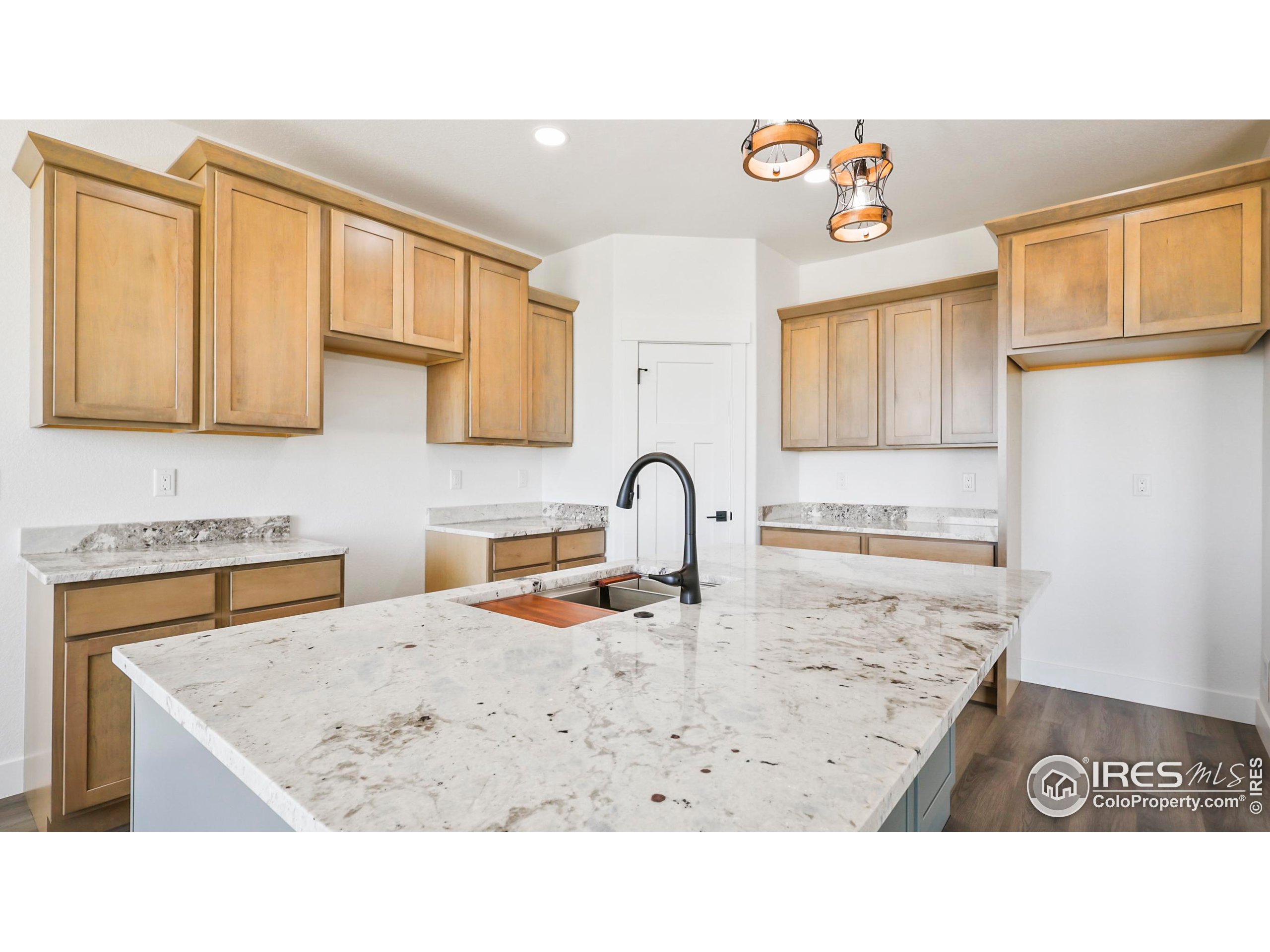448 Cache Avenue Fort Morgan, CO 80701 - Photo 11 of 44 a kitchen with a stove a sink and a microwave