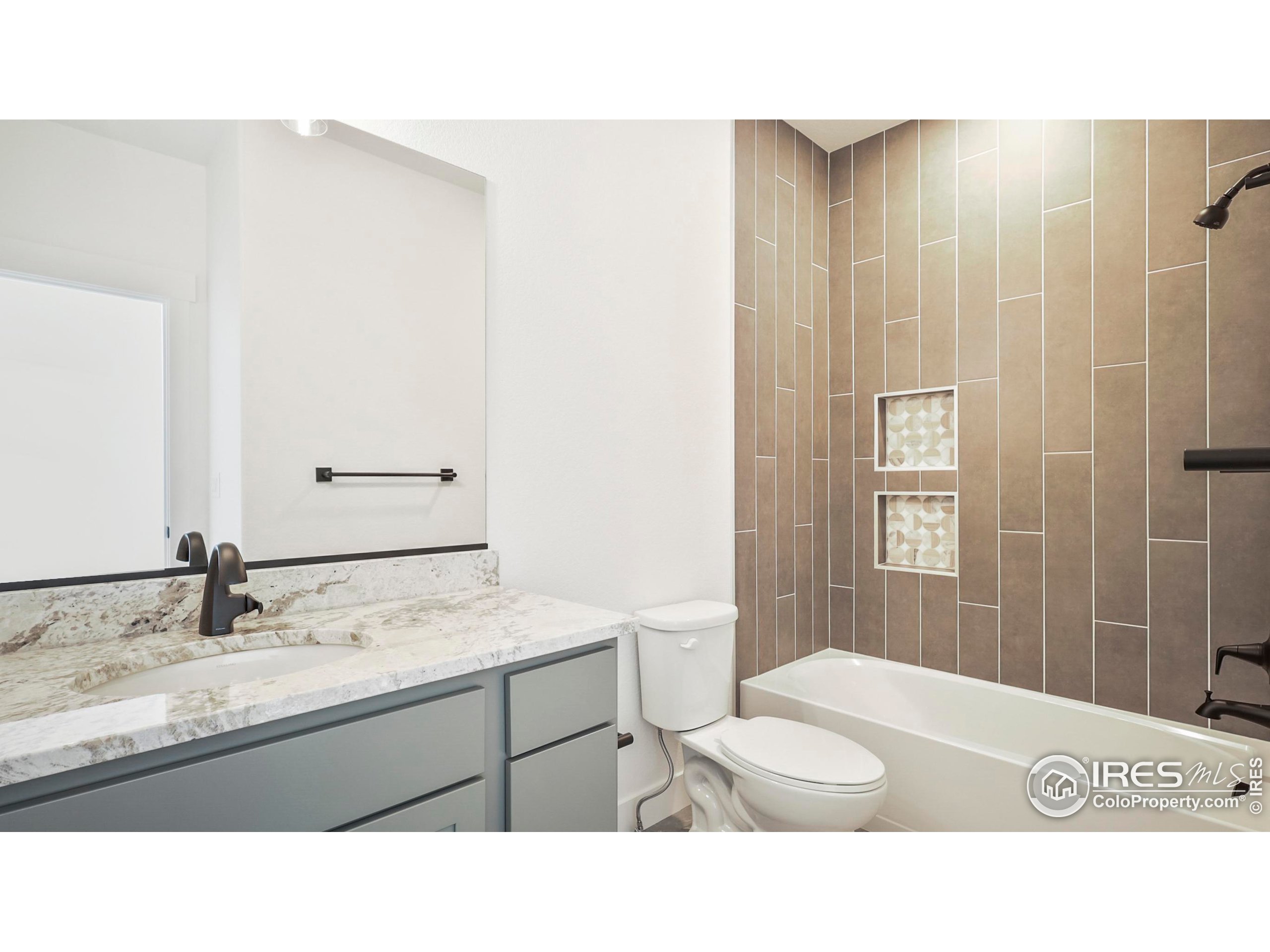 448 Cache Avenue Fort Morgan, CO 80701 - Photo 22 of 44 a bathroom with a sink a toilet and shower