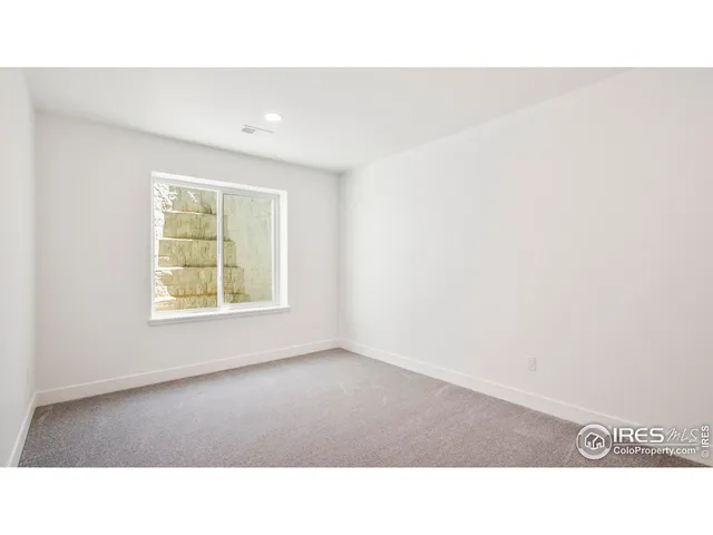 a open space with a cabinet and mirror