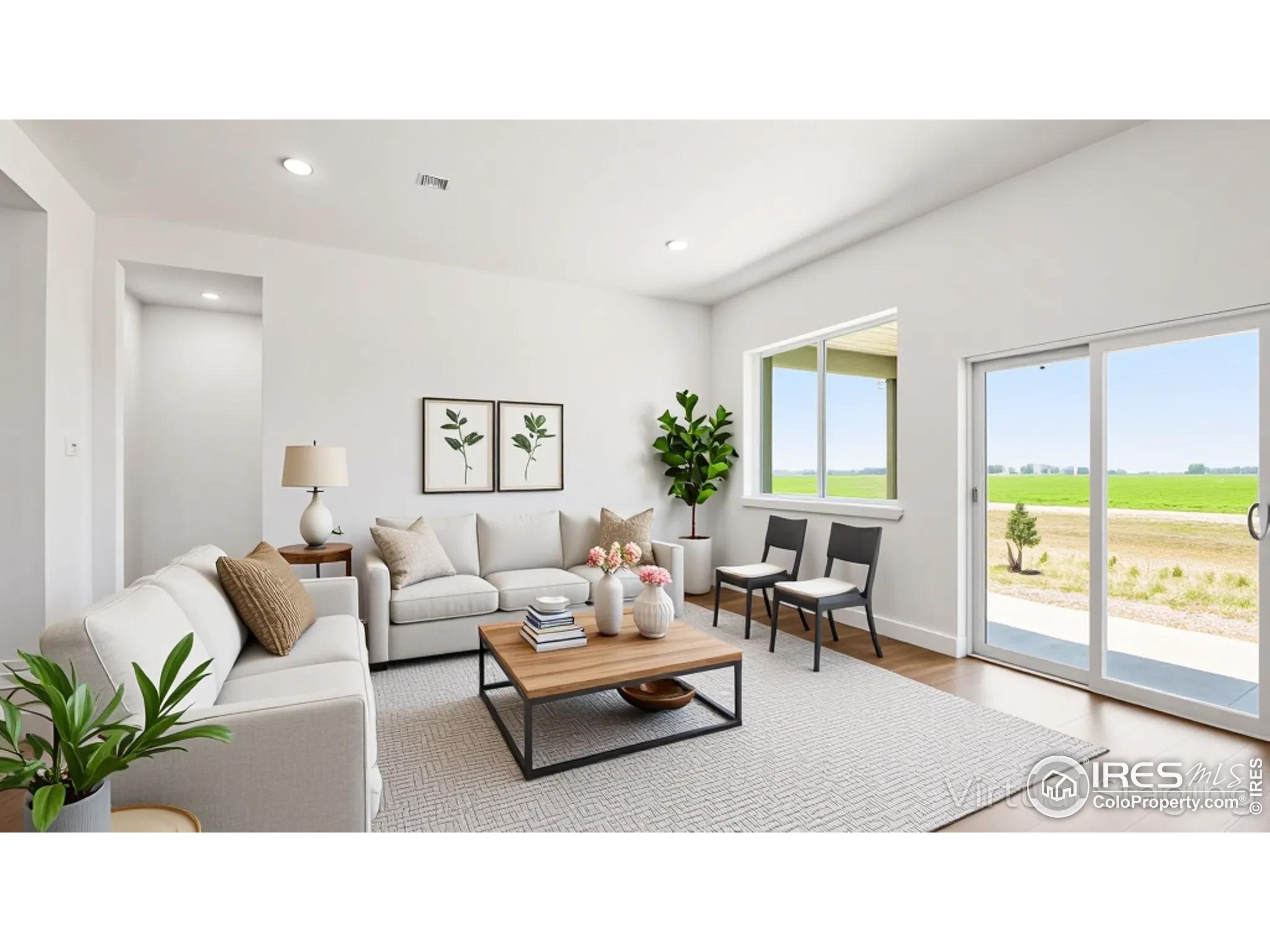 448 Cache Avenue Fort Morgan, CO 80701 - Photo 6 of 44 a living room with furniture potted plant and a large window